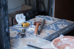Bathroom being renovated with tiles and tools